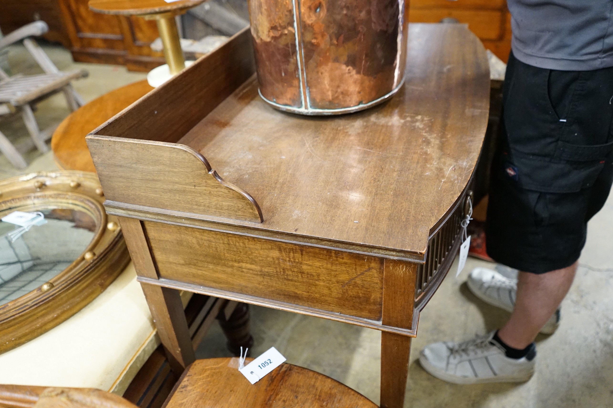 An Edwardian Chippendale revival mahogany bowfront wash stand, width 99cm, depth 50cm, height 88cm